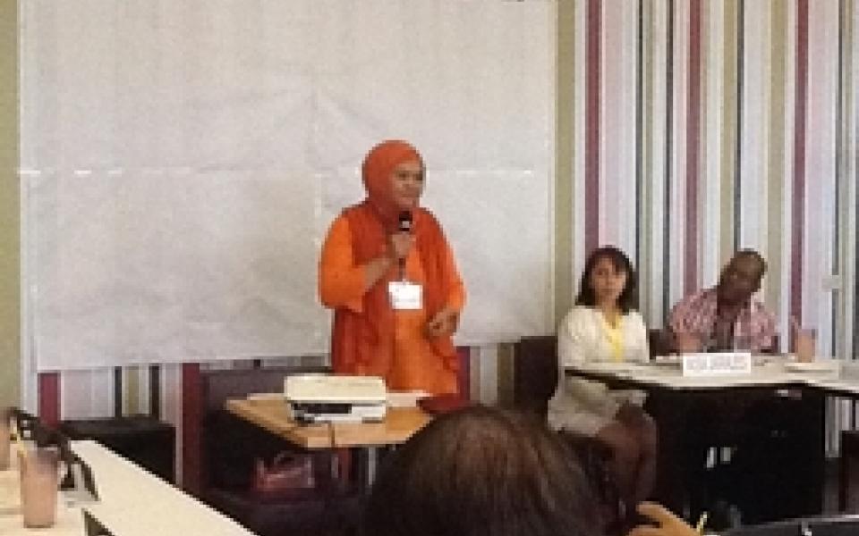 A women speaking to a crowd