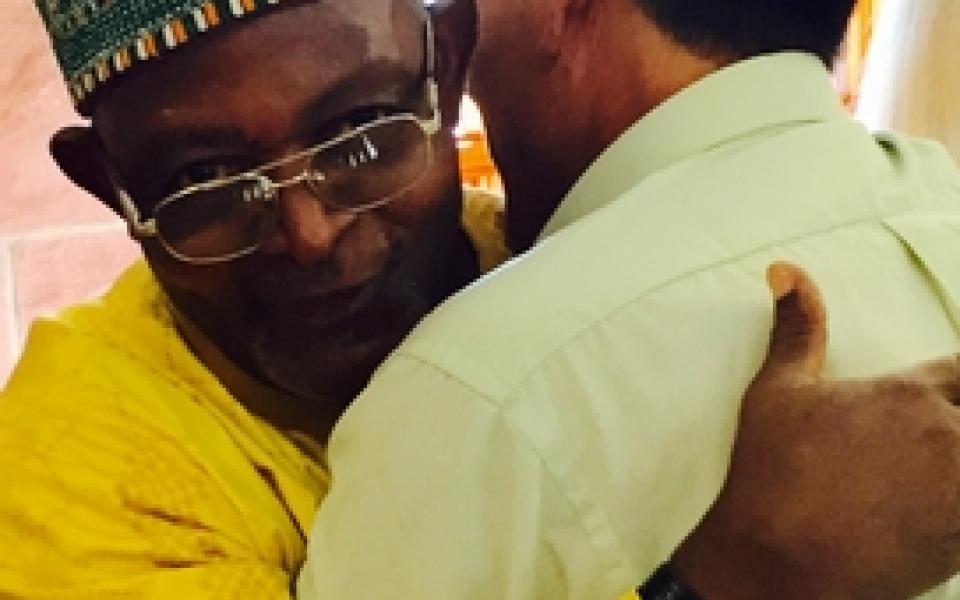 men hugging each other
