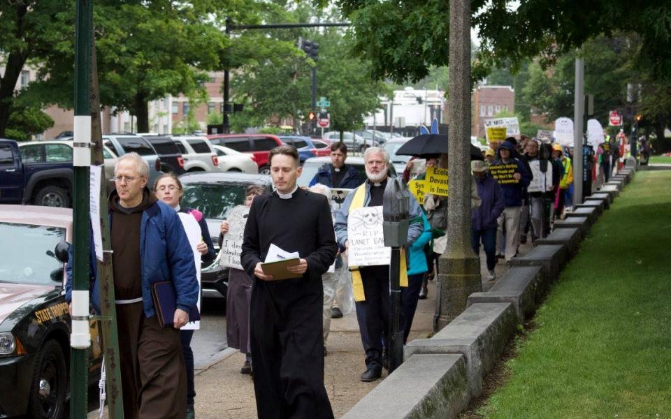 Members of the Poor People's Campaign march near the state capitol in New Hampshire.